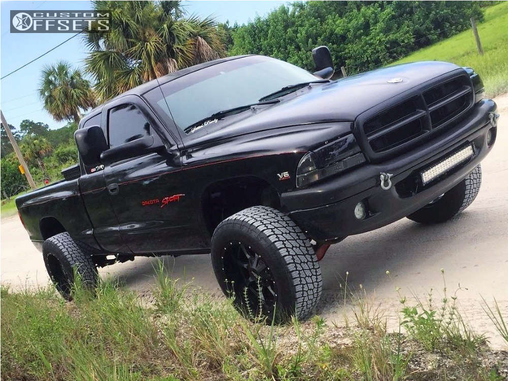 1999 Dodge Dakota with 18x10 -24 Moto Metal Mo970 and 275/65R18 Nitto Terra  Grappler G2 and Leveling Kit & Body Lift | Custom Offsets