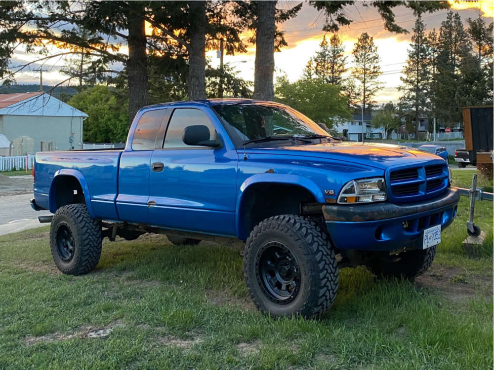 2000 Dodge Dakota with 17x10 -12 American Racing Ar201 and 33/11.5R17 Toyo  Tires Open Country M/t and Suspension Lift 6" | Custom Offsets