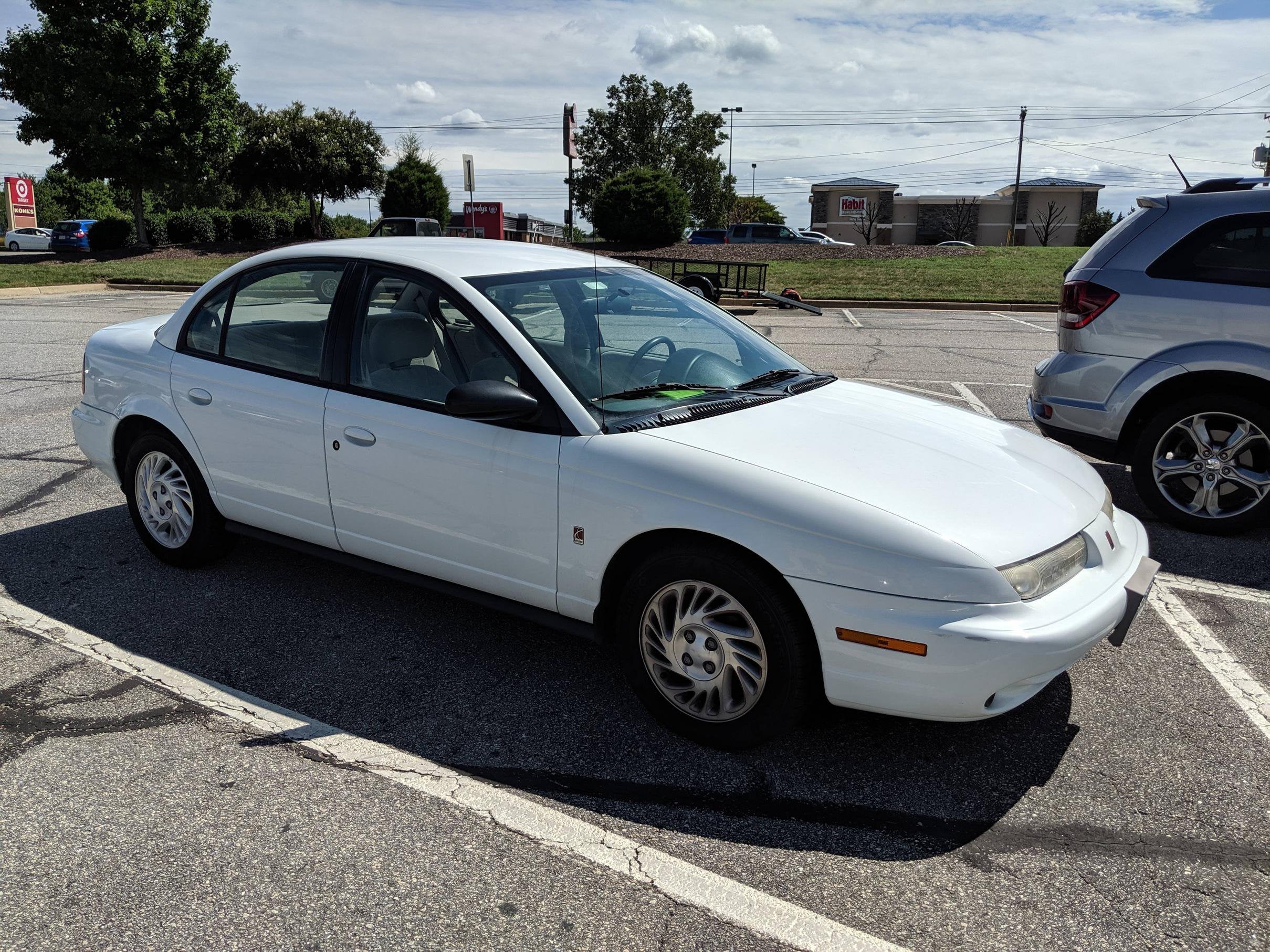 1998 Saturn SL2. I've only had it for a month and a half now, but the  reliability and fuel efficiency is stellar. : r/Saturn_Cars
