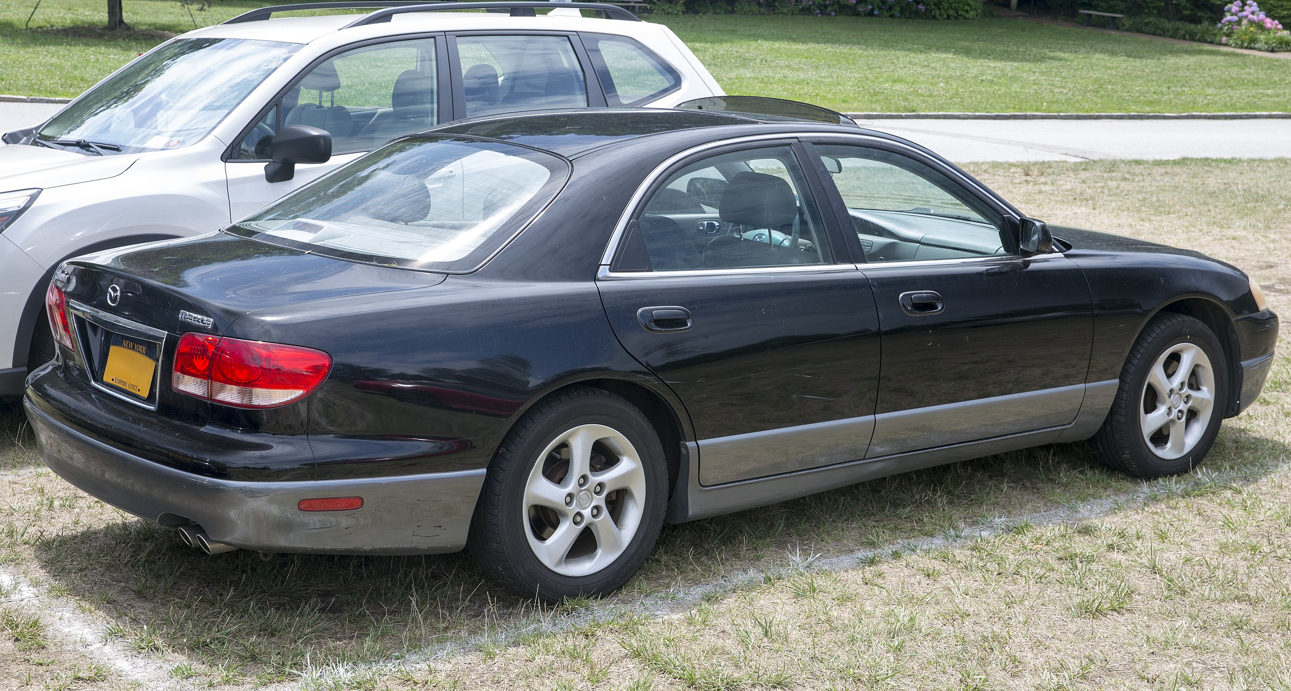 File:2002 Mazda Millenia in Black, rear right (Sands Point).jpg - Wikimedia  Commons