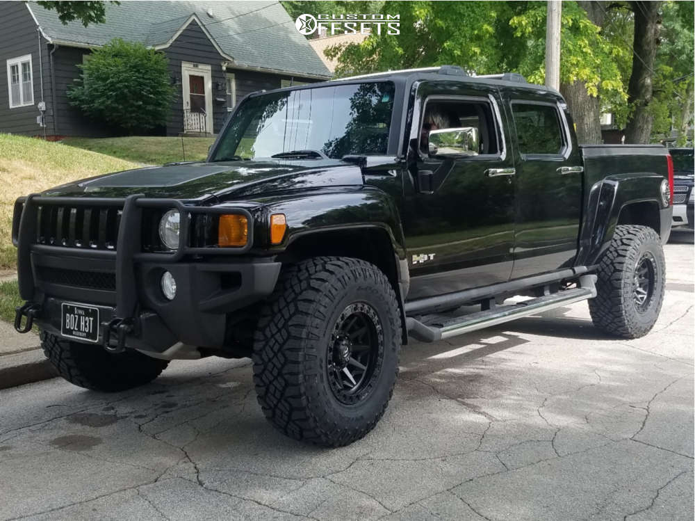 2010 Hummer H3T with 17x9 1 Fuel Cleaver and 35/12.5R17 Goodyear Wrangler  Duratrac and Leveling Kit | Custom Offsets