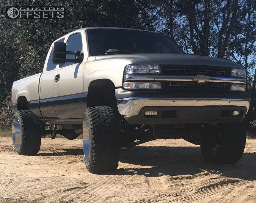 1999 Chevrolet Silverado 2500 with 24x14 -76 Hostile Alpha and 35/13.5R24  AMP Mud Terrain Attack MT A and Suspension Lift 6" | Custom Offsets