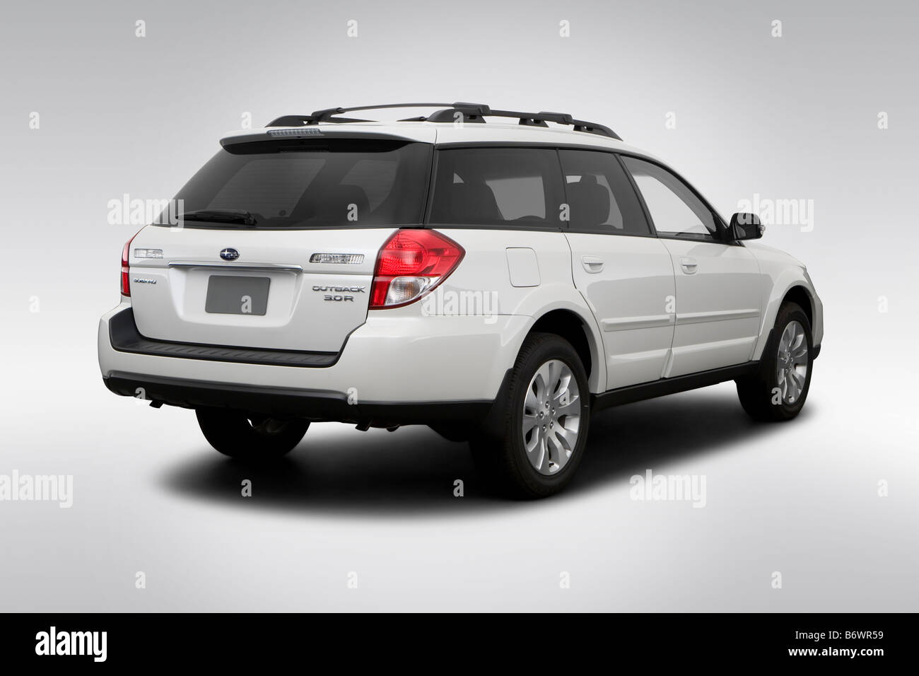 2009 Subaru Outback 3.0 R Limited in White - Rear angle view Stock Photo -  Alamy