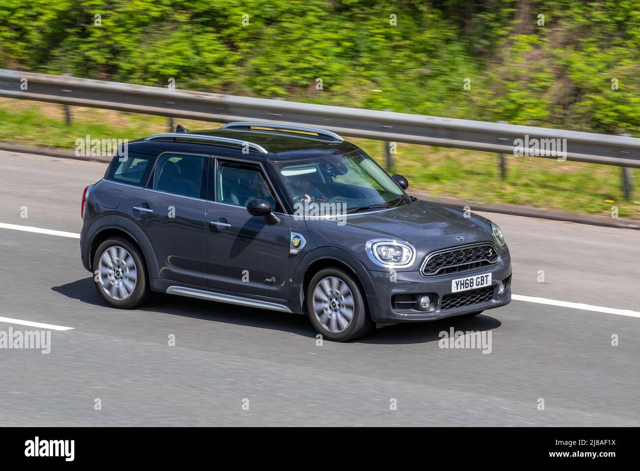 2019 grey Mini Countryman Cooper S E All4 A 224 8.8Kwh PHEV Hybrid Electric  SUV; driving on the M61 motorway, UK Stock Photo - Alamy