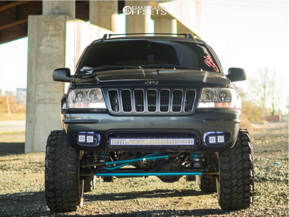 2001 Jeep Grand Cherokee with 22x14 -76 American Force Chopper Ss and  33/12.5R22 Gladiator Xcomp Mt and Suspension Lift 8" | Custom Offsets