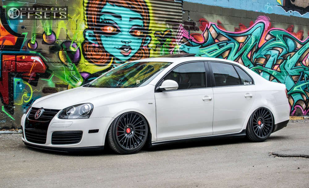 2010 Volkswagen Jetta with 18x9.5 35 Rotiform Ind-t and 215/40R18 Hankook  V12 and Air Suspension | Custom Offsets