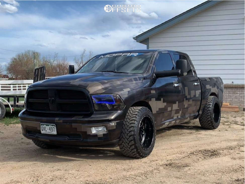2010 Dodge Ram 1500 with 22x12 -43 Fuel Triton D581 and 33/12.5R22 Toyo  Tires Open Country M/T and Stock | Custom Offsets